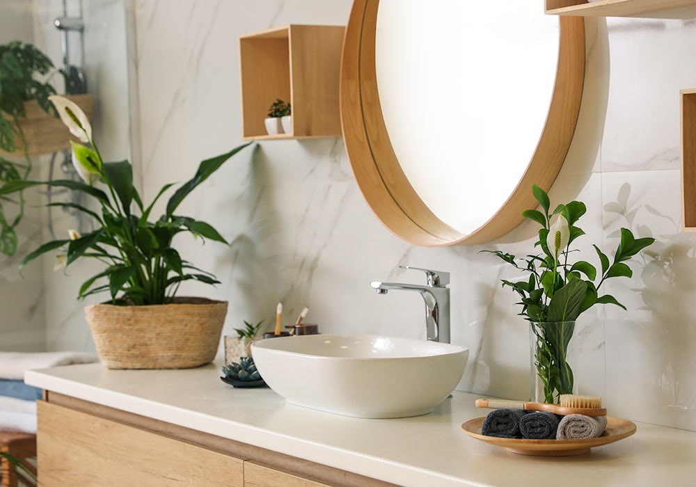 Bright green leaves spill from a wall-mounted planter