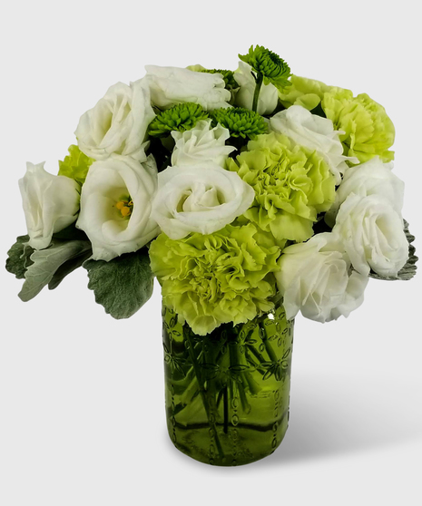 Green and white flowers designed in a vase